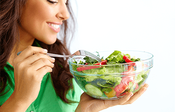 Lady eating a healthy salad